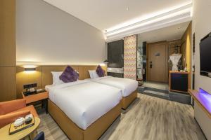 TV a/nebo společenská místnost v ubytování Sofitel Fuzhou Pop Hotel