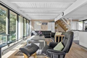 a living room with couches and chairs and windows at 0005-Romo-Moritzvej-5 in Høm