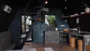 a kitchen with a black counter and a sink at Kurunda Estate Villa in Tangalle +48 photos