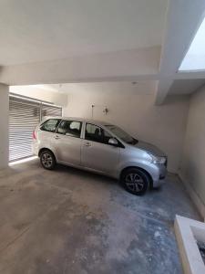 a small silver car parked in a garage at Descanso y Comodidad en Reynosa in Reynosa