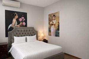 En eller flere senge i et værelse på Khánh Ly Hotel - 庆丽酒店