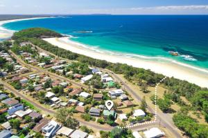 an aerial view of a beach with houses and the ocean at The Salty Deck in Narrawallee