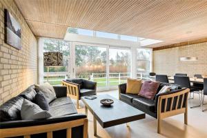 a living room with a couch and a table at 11804-Nykobing-Sj-Linesvej-2 in Nyrup