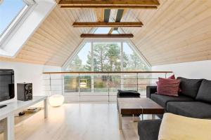 a living room with a large window and a couch at 11804-Nykobing-Sj-Linesvej-2 in Nyrup