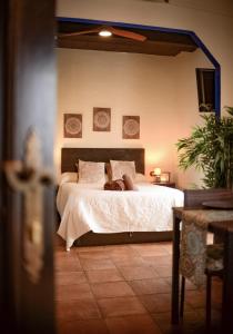 En eller flere senge i et værelse på Rincón ÁRABE junto al TEMPLO ROMANO y AYUNTAMIENTO