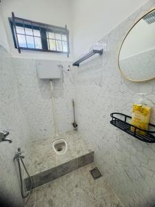 Koupelna v ubytování Nawra Iman Bayu Homestay + 10 fotografií