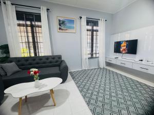 TV a/nebo společenská místnost v ubytování Nawra Iman Bayu Homestay