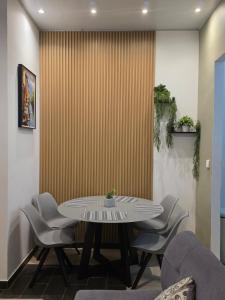 a dining room with a table and chairs at Confort en La Unión in La Unión +23 photos