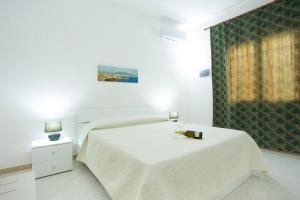 B&B Isole Dello Stagnone客房内的一张或多张床位