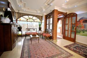 a living room with chairs and a large window at Side Hotel in Istanbul