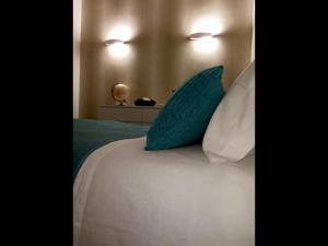 A bed or beds in a room at L'albero Di Famiglia