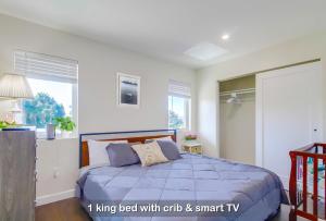 a bedroom with a king bed with cats and smart tv at Entire Private Home with 3 Bedrooms 3 Bathrooms, Near San Diego Downtown & Beach, Available Now in National City