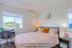 a bedroom with a bed with a desk and a chair at Entire Private Home with 3 Bedrooms 3 Bathrooms, Near San Diego Downtown & Beach, Available Now in National City +52 photos