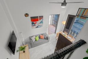 an overhead view of a living room with a couch at Old San Juan - Loft Balcony in San Juan