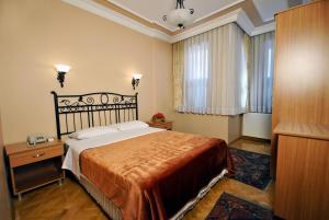 Postel nebo postele na pokoji v ubytování Side Hotel