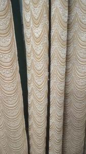 a close up of three white dresses on a wall at josh poonam in Prayagraj +1 photo