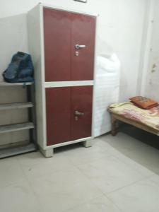 a cabinet with drawers and a bed in a room at josh poonam in Prayagraj