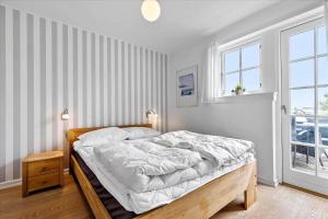 En eller flere senge i et værelse på 11202-Nykobing-Sj-Havnevej-91-1-th