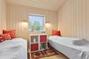 a bedroom with two beds and a window at 11802-Nykobing-Sj-Gogetoften-10 in Nyrup