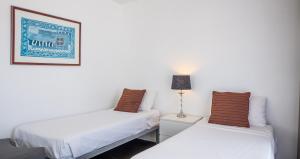 Postel nebo postele na pokoji v ubytování Broadbeach Savannah Resort