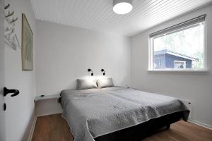 En eller flere senge i et værelse på 10034-Rorvig-Hojvaenget-2