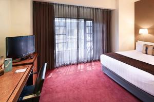 Letto o letti in una camera di Rendezvous Heritage Hotel Auckland