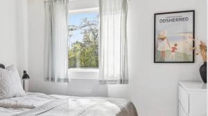 a bedroom with a bed and a window at 10041-1-Rorvig-Langesovej-2 in Rørvig