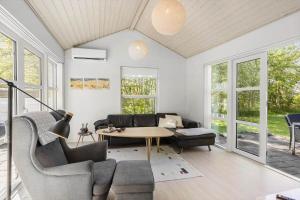 a living room with a table and chairs at LF21632-Spottrup-Rylevej-1 in Spottrup