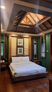 En eller flere senge i et værelse på Vanilla hill (hill lodge)