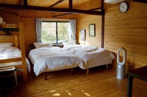 Postel nebo postele na pokoji v ubytování Sakura House サクラハウス 高知駅から車で20分-豊かな自然を味わう山の隠れ家