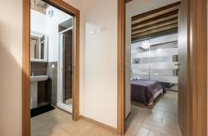 a hallway with a door leading to a bedroom at Damiani Appartamenti nel Centro Storico di Palermo in Palermo