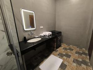 a bathroom with a sink and a mirror at Oasi house in Unawatuna +43 photos