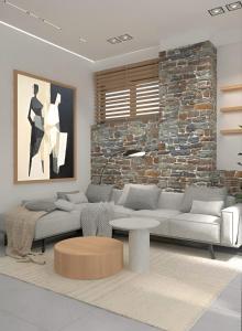 a living room with a couch and a table at Casa Euphoria in Elounda