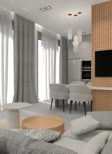 a living room with a couch and a dining room at Casa Euphoria in Elounda