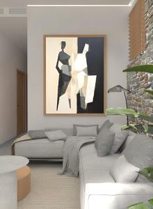 a living room with a couch and a painting at Casa Euphoria in Elounda +25 photos