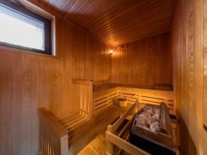 an inside of a wooden sauna with a window at Noemys Deneb in Risoul