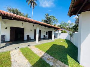 a view of the backyard of a house at Legacy Weligama - 8 min to Weligama Beach in Weligama