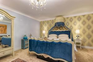 Postel nebo postele na pokoji v ubytování Kent Cottage