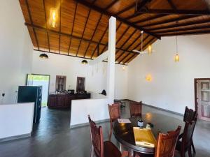 a dining room with a table and chairs at Legacy Weligama - 8 min to Weligama Beach in Weligama