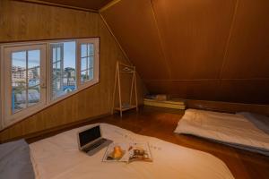 En eller flere senge i et værelse på Villa Sân Vườn Nam Hồ