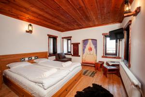 En eller flere senge i et værelse på Къща за гости Родопчани