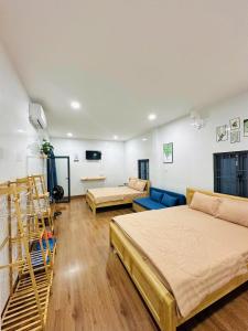 En eller flere senge i et værelse på Doc Bien Homestay Mui Ne - Entire Home