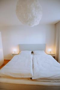 En eller flere senge i et værelse på Emsperle