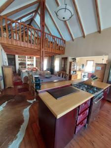 a kitchen with a stove top oven in a room at Tevreden in Rhodes +4 photos