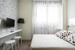 Posteľ alebo postele v izbe v ubytovaní Residencia Universitaria Resa Blas De Otero