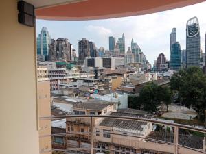 a view of the city from a window at Hotel Soni Mansion Pratunam in Bangkok