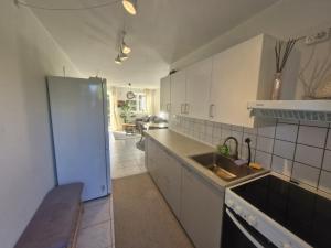 a kitchen with a sink and a counter top at Cozy Airport stay in Copenhagen