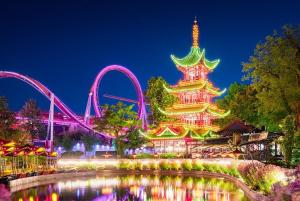 a night view of a roller coaster and a amusement park at Cozy Airport stay in Copenhagen +4 photos