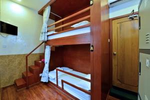 A bunk bed or bunk beds in a room at Backpacker(Bed & Breakfast)