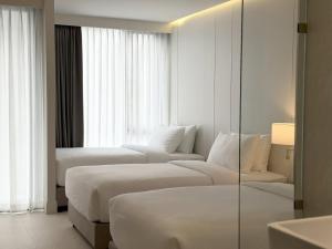 En eller flere senge i et værelse på POR Kotchasarn